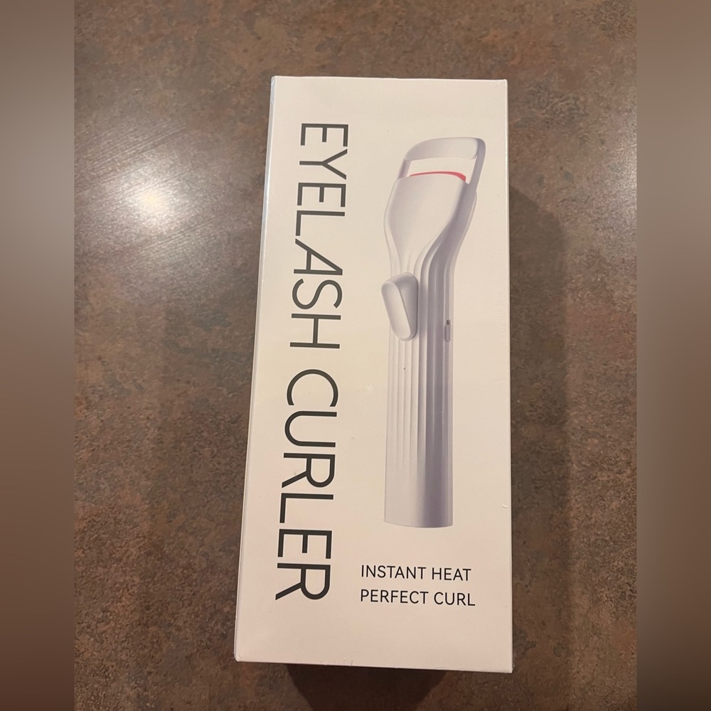 Heated eyelash curler